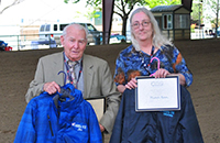 Jim Curry and Michele Nelson with awards