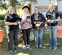 Buckle winners posed with buckles